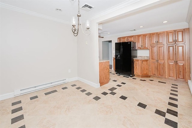 kitchen with hanging light fixtures, ornamental molding, baseboard heating, black fridge, and an inviting chandelier