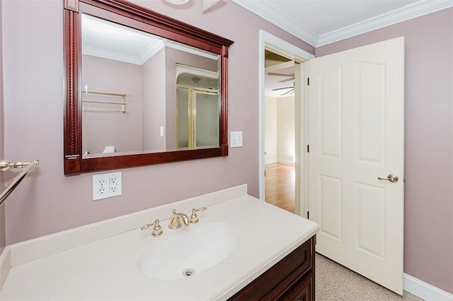 bathroom featuring vanity, an enclosed shower, and ornamental molding