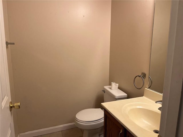 bathroom with vanity, toilet, and tile patterned flooring