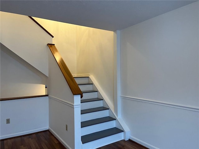 stairway featuring hardwood / wood-style flooring