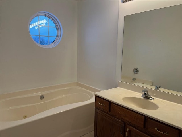 bathroom with vanity and a bath