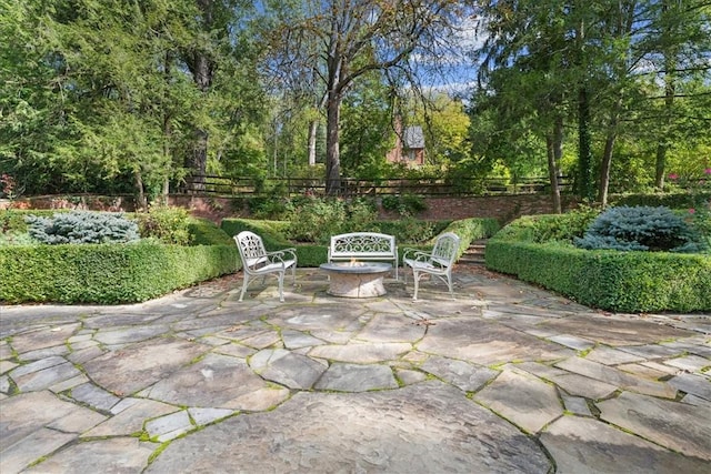 view of patio / terrace featuring a fire pit