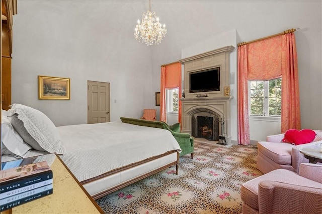 bedroom with a towering ceiling, light carpet, and a chandelier