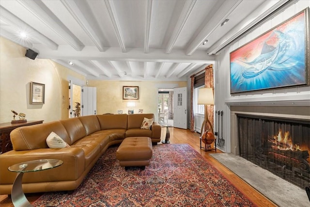430 Woodland Rd, Edgeworth, PA 15143 - living room with wood finished floors, beamed ceiling, and a fireplace with flush hearth