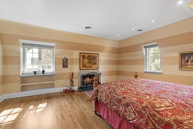 430 Woodland Rd, Edgeworth, PA 15143 - bedroom with wood finished floors, baseboards, a lit fireplace, and recessed lighting