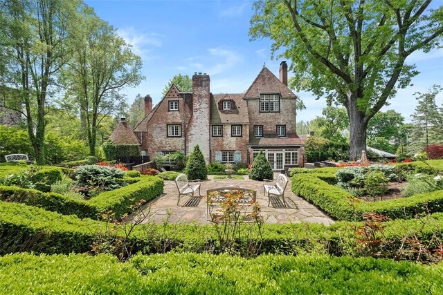 430 Woodland Rd, Edgeworth, PA 15143 - rear view of house featuring a patio area, a chimney, and french doors