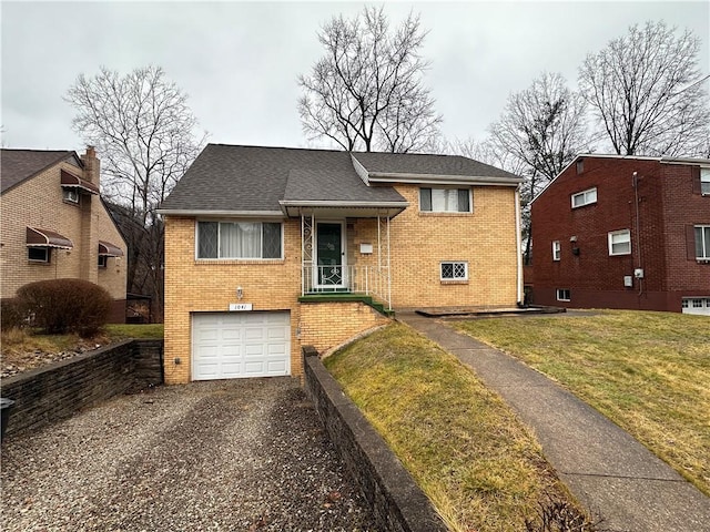 split level home with brick siding, a front lawn, driveway, roof with shingles, and a garage