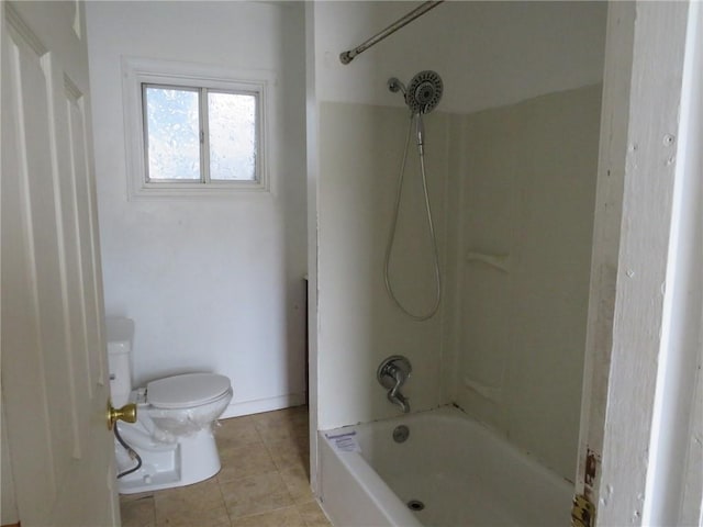 bathroom with tile patterned flooring, baseboards, shower / bath combination, and toilet