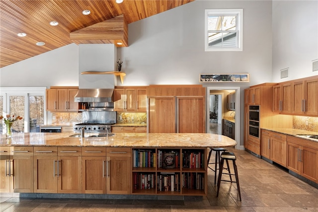 kitchen featuring high vaulted ceiling, wooden ceiling, double oven, and wall chimney exhaust hood