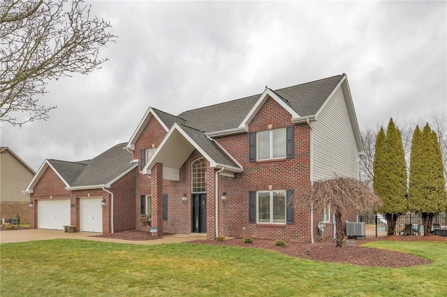 front facade with a garage, central AC, and a front lawn