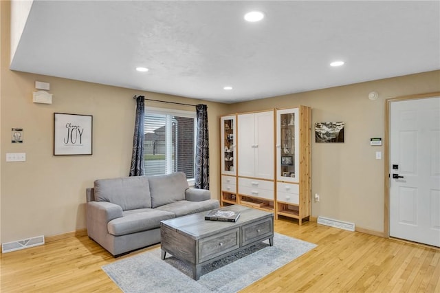 living room with light hardwood / wood-style flooring