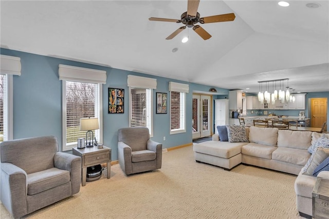 carpeted living room featuring vaulted ceiling, an AC wall unit, and ceiling fan