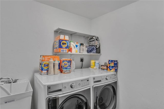 laundry room with sink and washer and dryer