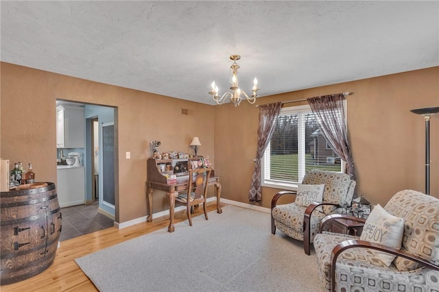 living area with hardwood / wood-style flooring and a notable chandelier