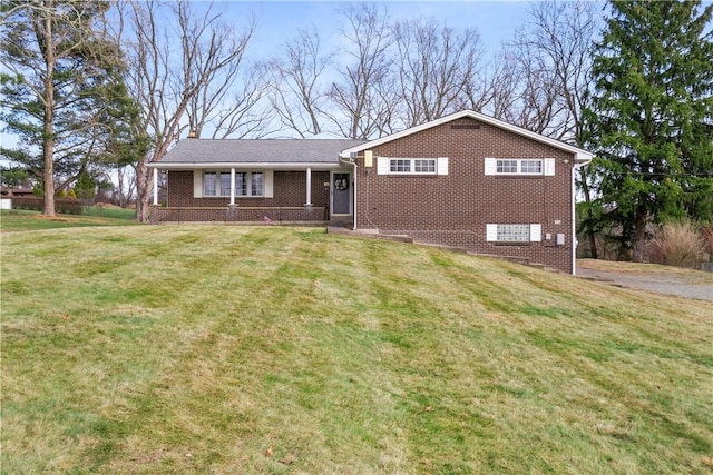 view of front of home with a porch and a front lawn