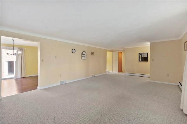 carpeted empty room with an inviting chandelier, ornamental molding, and a baseboard heating unit