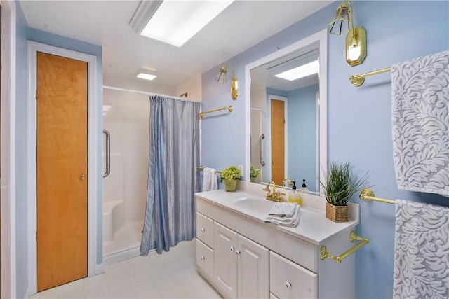 bathroom featuring vanity and curtained shower