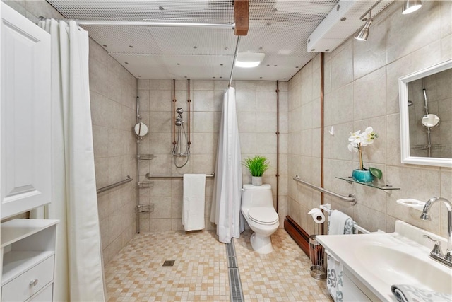 bathroom featuring vanity, toilet, a shower with shower curtain, and tile walls