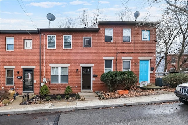 view of property with brick siding