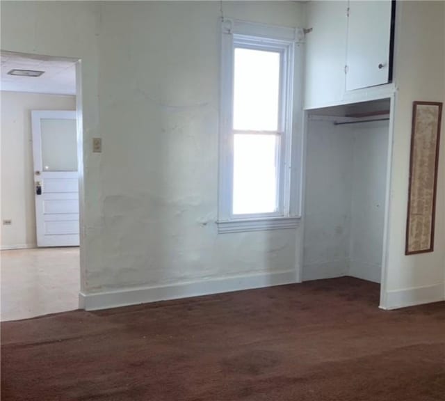 unfurnished room with dark hardwood / wood-style flooring