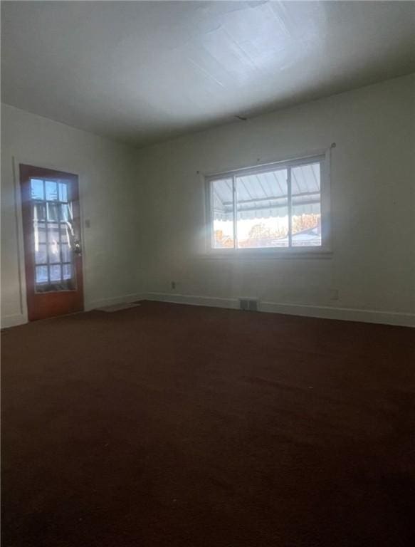 spare room with carpet floors