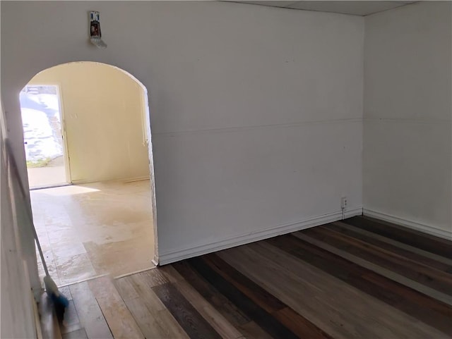 unfurnished room with hardwood / wood-style floors