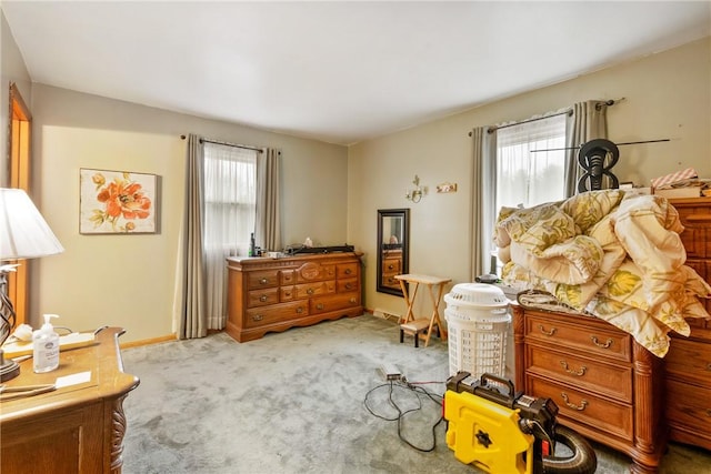 interior space with light colored carpet and plenty of natural light