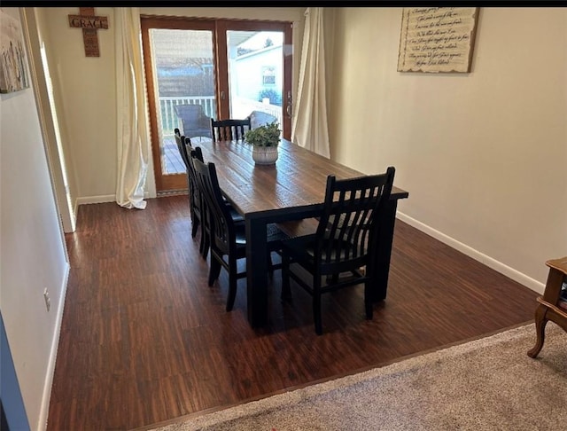 dining room with dark wood-type flooring