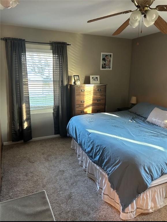 bedroom featuring ceiling fan and carpet flooring