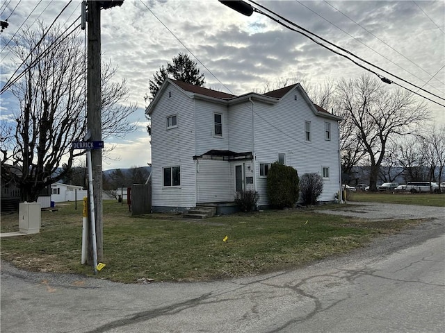 view of property exterior featuring a yard