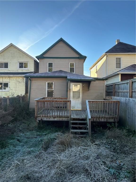 back of house with a wooden deck