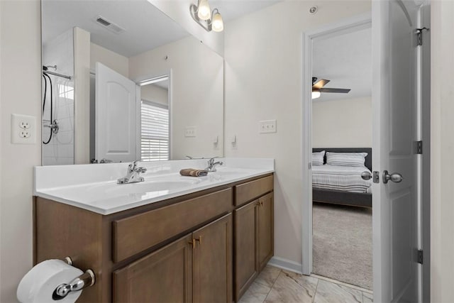 bathroom with ceiling fan and vanity