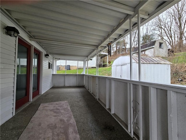 view of patio with an outbuilding