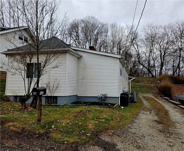 view of home's exterior with a lawn