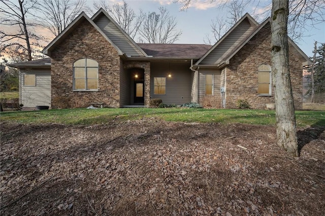 view of front of property with a yard