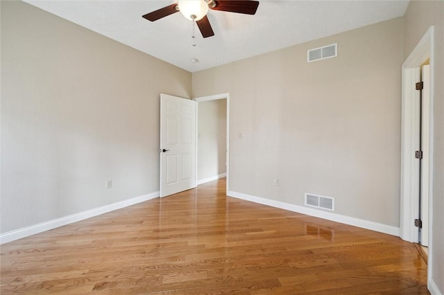 spare room with ceiling fan and light hardwood / wood-style floors