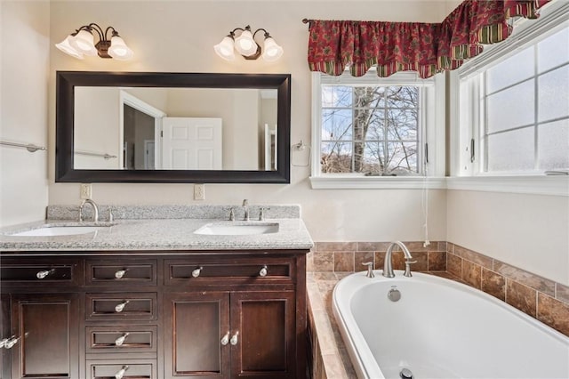 bathroom with vanity and tiled bath