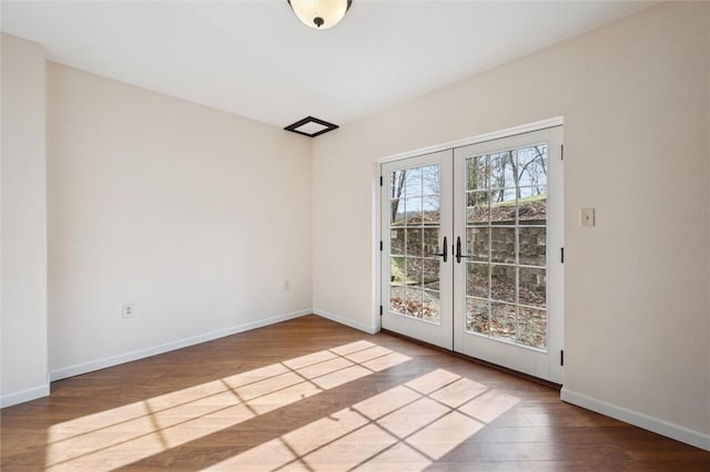 interior space with wood-type flooring and french doors