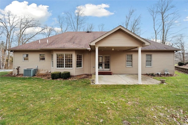 rear view of property with a yard, a patio, central air condition unit, and french doors