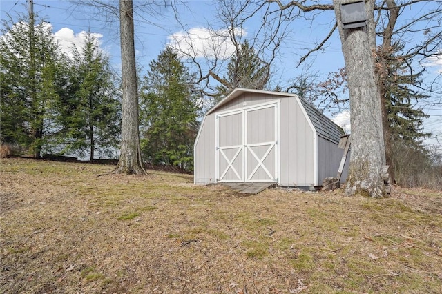 view of outdoor structure with a lawn