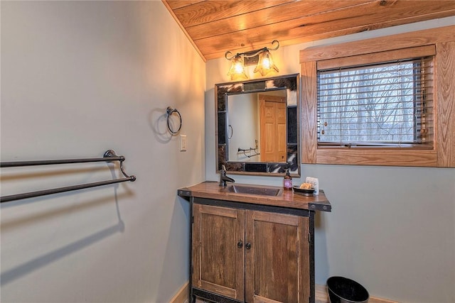 bathroom with vanity and wooden ceiling