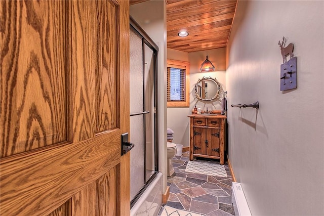 full bathroom featuring toilet, wood ceiling, vanity, enclosed tub / shower combo, and a baseboard heating unit