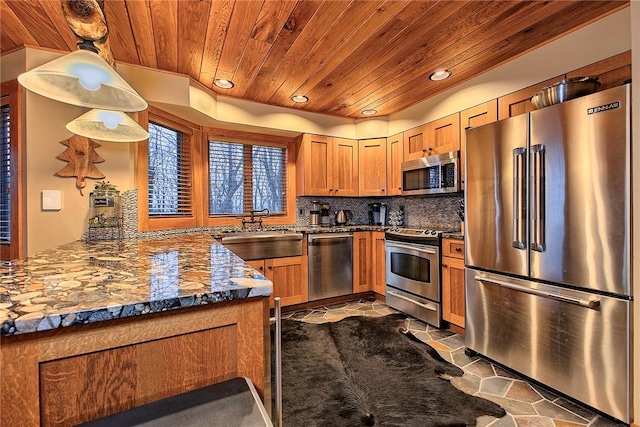 kitchen with sink, wooden ceiling, kitchen peninsula, pendant lighting, and stainless steel appliances