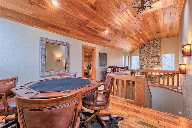 interior space with wood-type flooring, lofted ceiling, and wooden ceiling