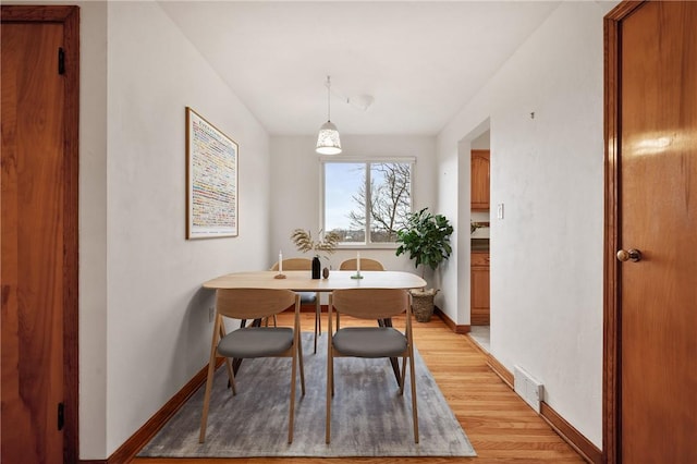 dining space featuring light hardwood / wood-style flooring