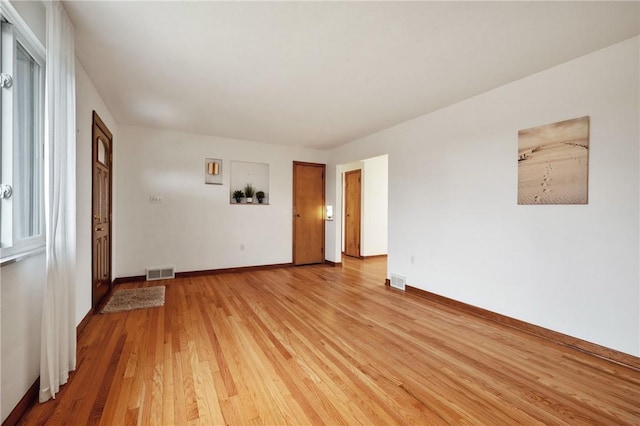 unfurnished room with light hardwood / wood-style flooring