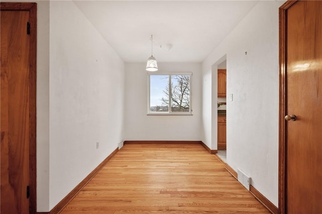 hall with light hardwood / wood-style floors