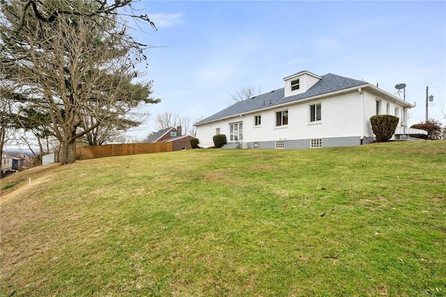 back of house featuring a lawn