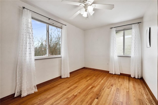 unfurnished room featuring ceiling fan and light wood-type flooring