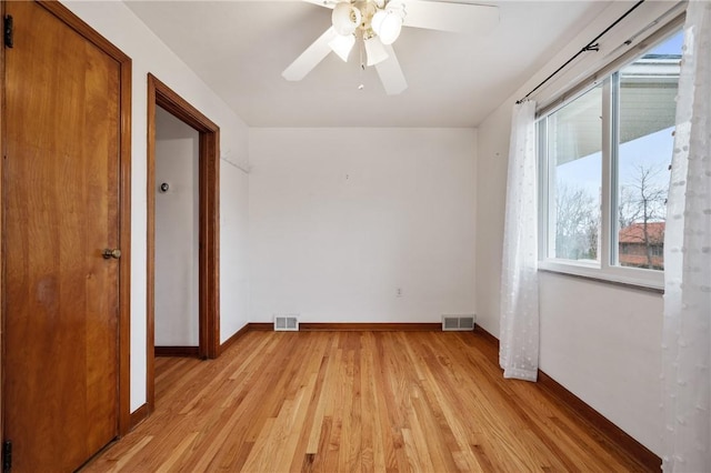 spare room featuring ceiling fan and light wood-type flooring